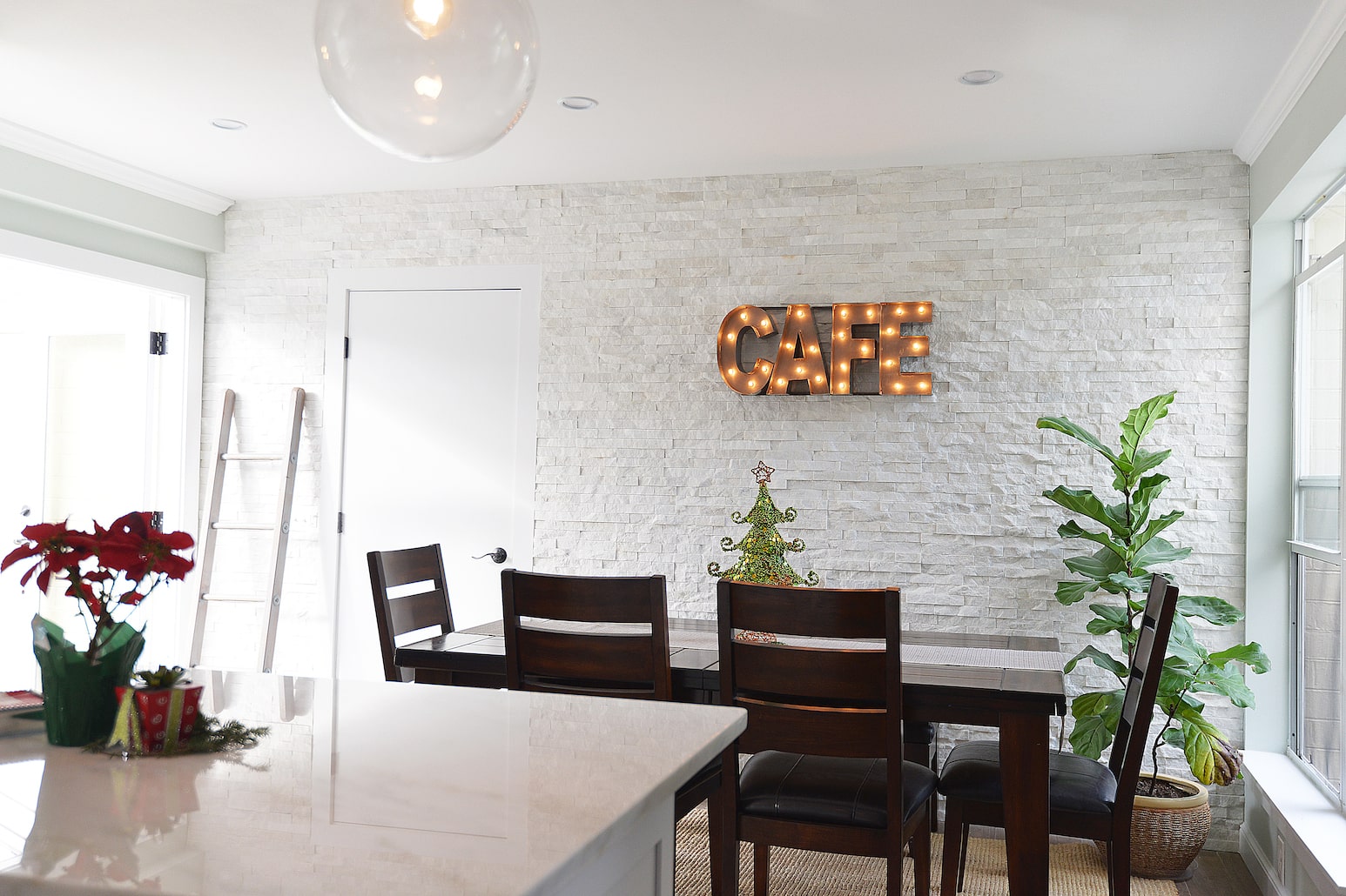 Norstone White Rock Panels on a prominent feature wall in a cozy modern inspired kitchen and dining area